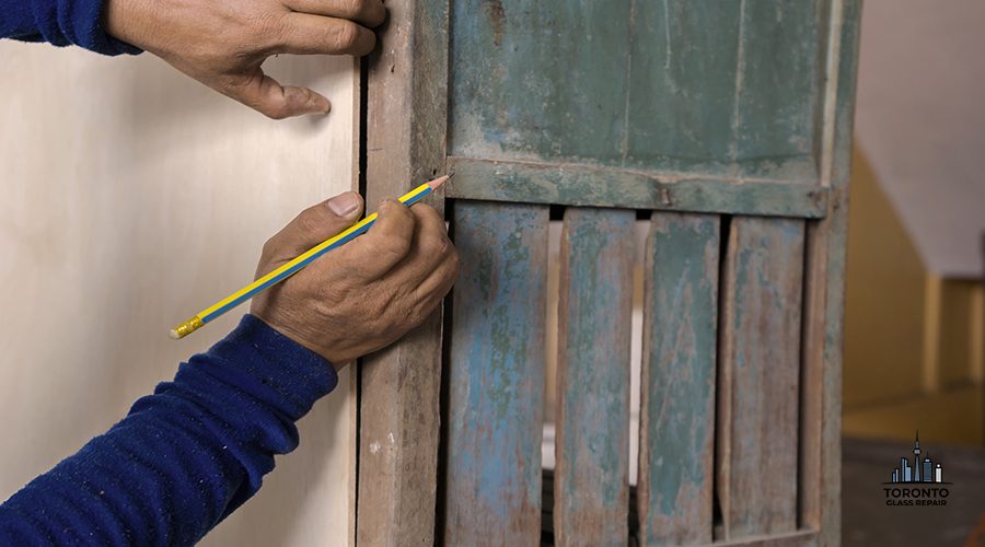 Carpenter working on woodworking machines in carpentry shop. A man works in a carpentry shop.