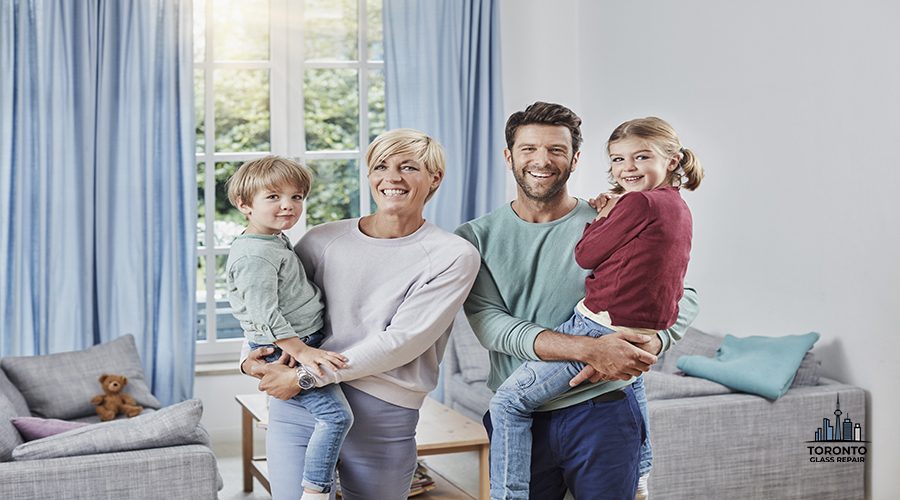 Portrait of happy family with two kids at home